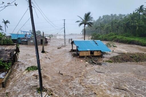 Surging floodwaters driven by Typhoon Fung-wong swamp homes on the coast in the Philippines' Catanduanes province