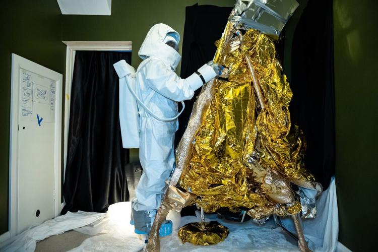 Artist helps first women to walk on the moon – by turning her front room into the lunar surface filed with moon rock.