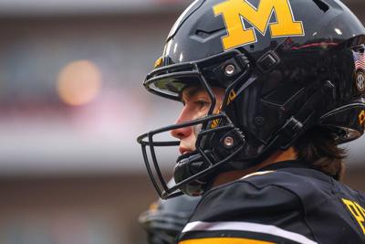 Mizzou quarterback Beau Pribula (9) warms up before the annual Battle Line Rivalry