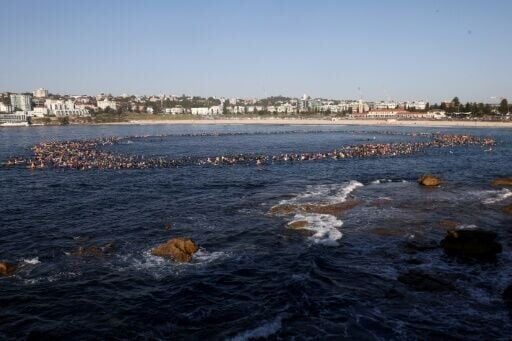 Crowds took the water of Sydney's Bondi Beach to remember those killed in a mass shooting
