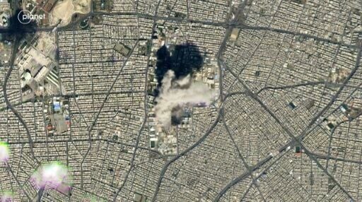 Handout satellite images taken by 2026 Planet Labs PBC show smoke billowing from central Tehran after US and Israeli strikes