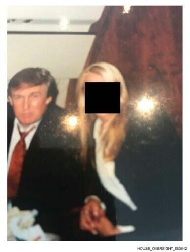 This undated photo from the estate of convicted sex offender Jeffrey Epstein released by Democrats on the House Oversight Committee shows Donald Trump with a woman whose face has been redacted