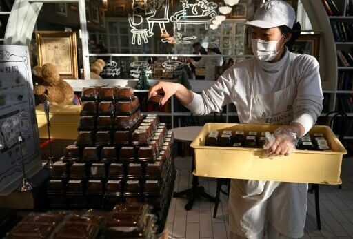 An employee displays the cookies at a bakery in Seoul