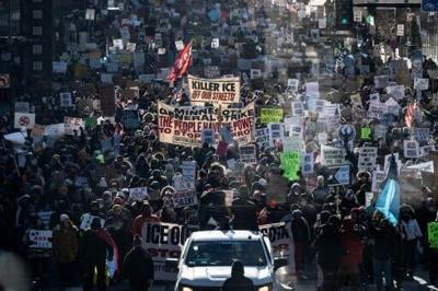 Protesters against Immigration and Customs Enforcement (ICE) march through the streets of downtown Minneapolis, Minnesota, on January 25, 2026