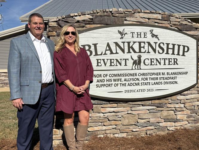 Blankenship and wife at Forever Wild sign with their name