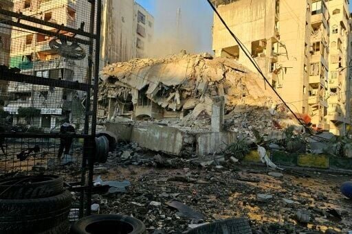 Rubble and debris are strewn across a road at the site of an Israeli airstrike that targeted Beirut’s southern suburbs, in the al Kafaat neighborhood, on March 17, 2026.