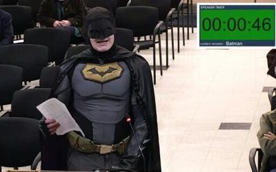 This frame grab from a January 27, 2026, video from a City of Santa Clara, California council meeting shows a man dressed as Batman berating officials in the city