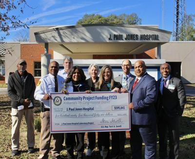 Sewell presents check to J. Paul Jones Hospital