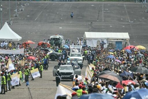 Pope Leo XIV (C) heads to the port city of Douala for a huge open-air mass on the third day of his Cameroon tour