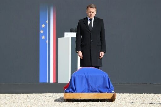 French President Emmanuel Macron pays his respects at the coffin of Lionel Jospin