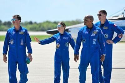 (L-R) Reid Wiseman, Christina Koch, Victor Glover and Jeremy Hansen arrive in Florida ahead of their planned journey around the Moon