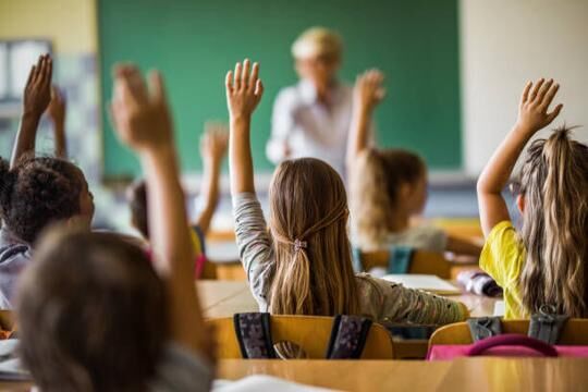 Students raising hands