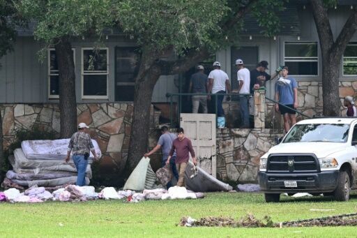 Rescuers on horseback, with dogs search for Texas flood victims