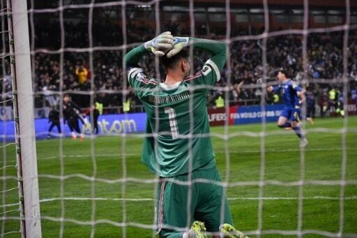 Italy goalkeeper Gianluigi Donnarumma reacts after his team lost on penalties to Bosnia and Hercegovina in their World Cup qualifying play-off final on Tuesday