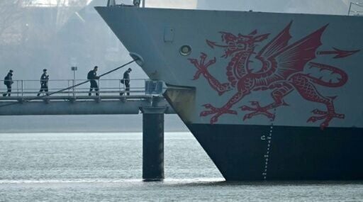 Troops arrive to board HMS Dragon