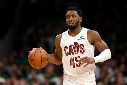 Cavs hold off Heat to book NBA playoff berth