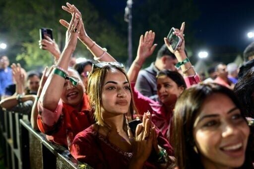 Revellers enjoy Hindu spiritual songs called 'bhajans' during the Sanatan Journey devotional music festival at the Purana Qila in New Delhi on March 1, 2026
