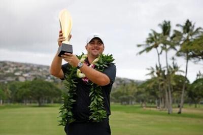 Chris Gotterup celebrates with the trophy after winning this year's Sony Open. The PGA Tour is now scrapping its season-opening swing in Hawaii