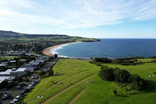 Some Gerringong residents have resorted to extreme measures, turning on garden sprinklers to prevent tourists from taking pictures on their lawns