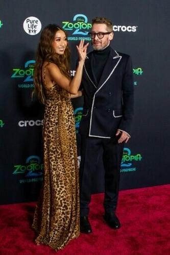 US actor Macaulay Culkin (R), the vocal performer for Cattrick Lynxley, and US actress Brenda Song attend the world premiere of Walt Disney Animation Studios' "Zootopia 2" in Los Angeles, California