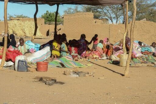 Sudanese displaced people who left El-Fasher at a reception point in Tawila