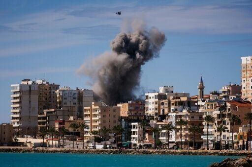 A plume of smoke rises from the site of an Israeli airstrike on the eastern outskirts of Tyre, in southern Lebanon