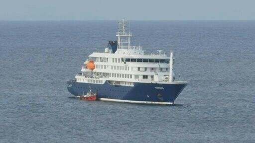 Ambulance boat arrives at virus-hit cruise ship for passenger evacuation