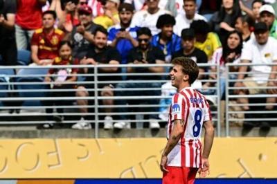 Barrios double gets Atletico back on track