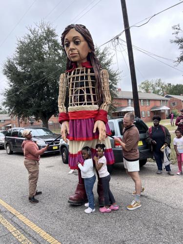 Little Amal puppet wows Selma as crowd gathers to follow her through downtown, photo gallery