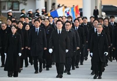 South Korean President Lee Jae Myung (centre) walks with his cabinet members as he visits the National Cemetery in Seoul on January 1. Soaring global demand for semiconductors fuelled by a boom in artificial intelligence sent South Korea's exports to th...