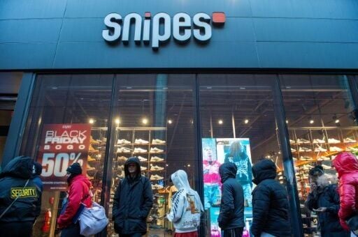 The National Retail Federation pointed to record turnout over the weekend, with customers lining up, as in this Boston scene from 'Black Friday'