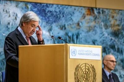 UN Secretary-General Antonio Guterres (L) addresses the audience at the opening of the UN Human Rights Council