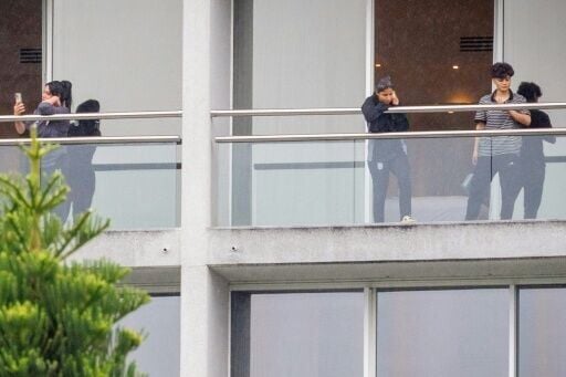 Members of the Iranian women’s football team are seen on their respective room balconies at the Royal Pines Resort on the Gold Coast on March 9, 2026