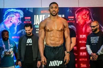Britain's Anthony Joshua will weigh nearly 30 pounds heavier than Jake Paul in their Netflix-backed fight in Miami