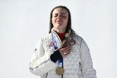 Breezy Johnson on the podium aftre winning the women's downhill event during the Milano Cortina 2026 Winter Olympics