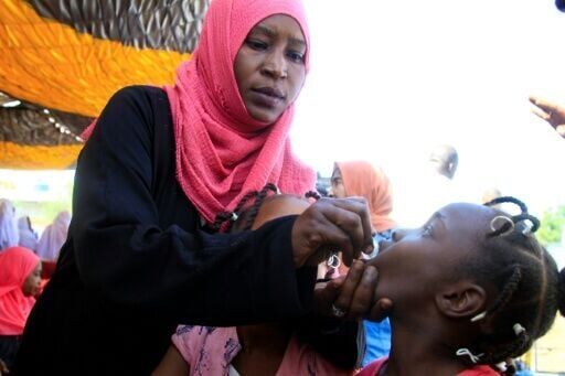 A child receives a cholera vaccine dose in Gedaref during a campaign to combat the outbreak in war-torn Sudan