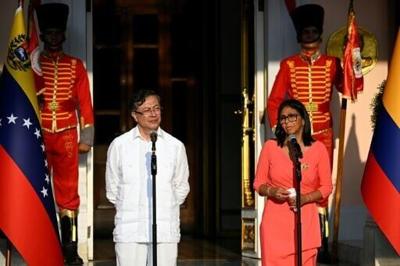 Venezuela's interim president Delcy Rodriguez (R) and Colombian President Gustavo Petro deliver statements after a bilateral meeting at the Miraflores presidential palace in Caracas on April 24, 2026