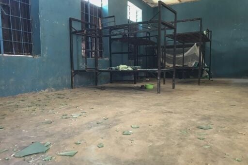 Empty bunk beds, shattered glass and scattered belongings are all that remain in this student dormitory at the school