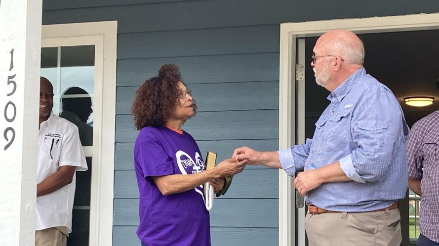 Long-term Recovery Group hands keys to four new homeowners