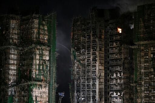 Authorities said the fire at the eight-building Wang Fuk Court residential estate had been contained to four units, of the roughly 2,000 in the complex