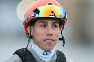 Irad Ortiz Jr., jockey of Kentucky Derby favorite Renegade, watches in the barn area at Churchill Downs after morning workouts ahead of the 152nd Run for the Roses