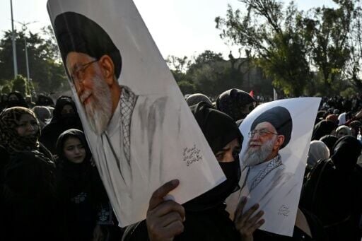 Shiite Muslims hold portraits of Iran's late supreme leader Ayatollah Ali Khamenei as they protest at the US embassy in Islamabad on March 1, 2026