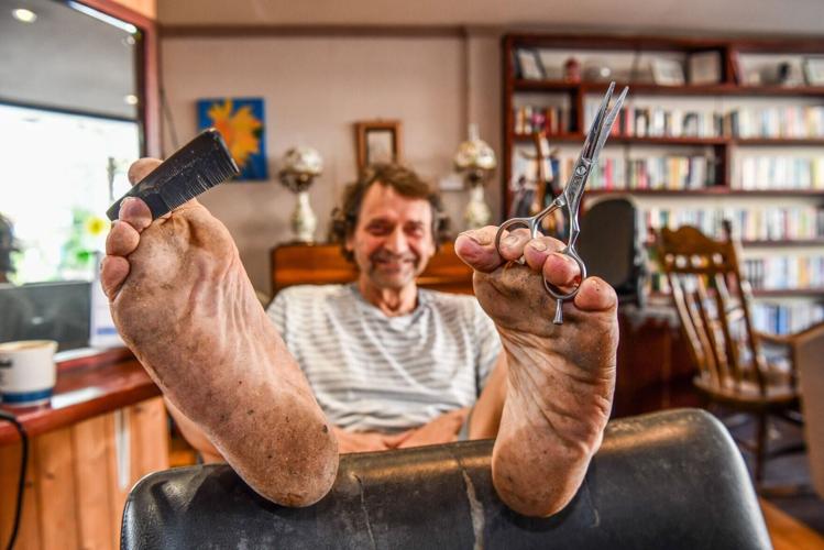 Barefoot barber stopped wearing shoes 20 years ago – even at work
