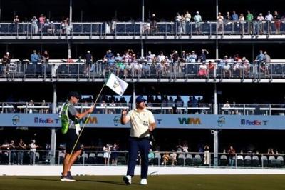 American Chris Gotterup acknowledges the crowd on the 16th green on the way to the first-round lead in the US PGA Tour Phoenix Open