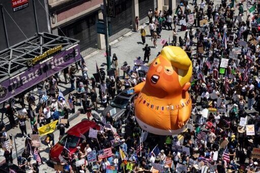 Trump flexes military might at parade as protests sweep US