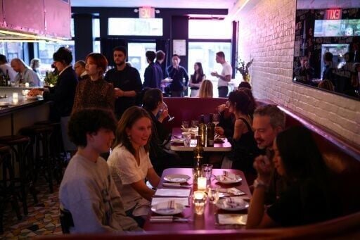 Customers eat during dinner in the French restaurant Gigi’s in the Brooklyn borough of New York on April 26, 2026.