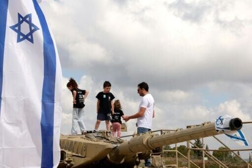 Children climb atop old tanks at the Israeli Armoured Corps memorial in Latrun, between Jerusalem and Tel Aviv