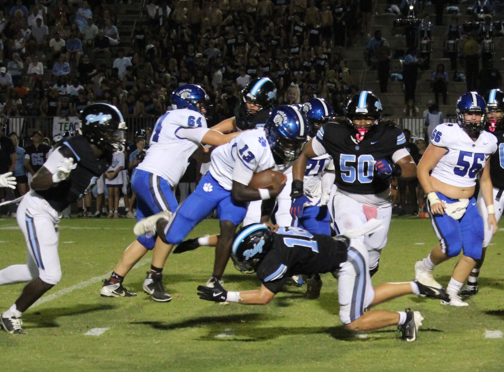 Braylen Wallace sails through the air in a run against Northridge