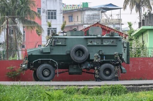 Security personnel stand guard outside the counting centre at Damak in Jhapa district