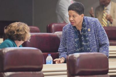 Rep. Adline Clarke, D-Mobile, speaks to Rep. Marilyn Lands